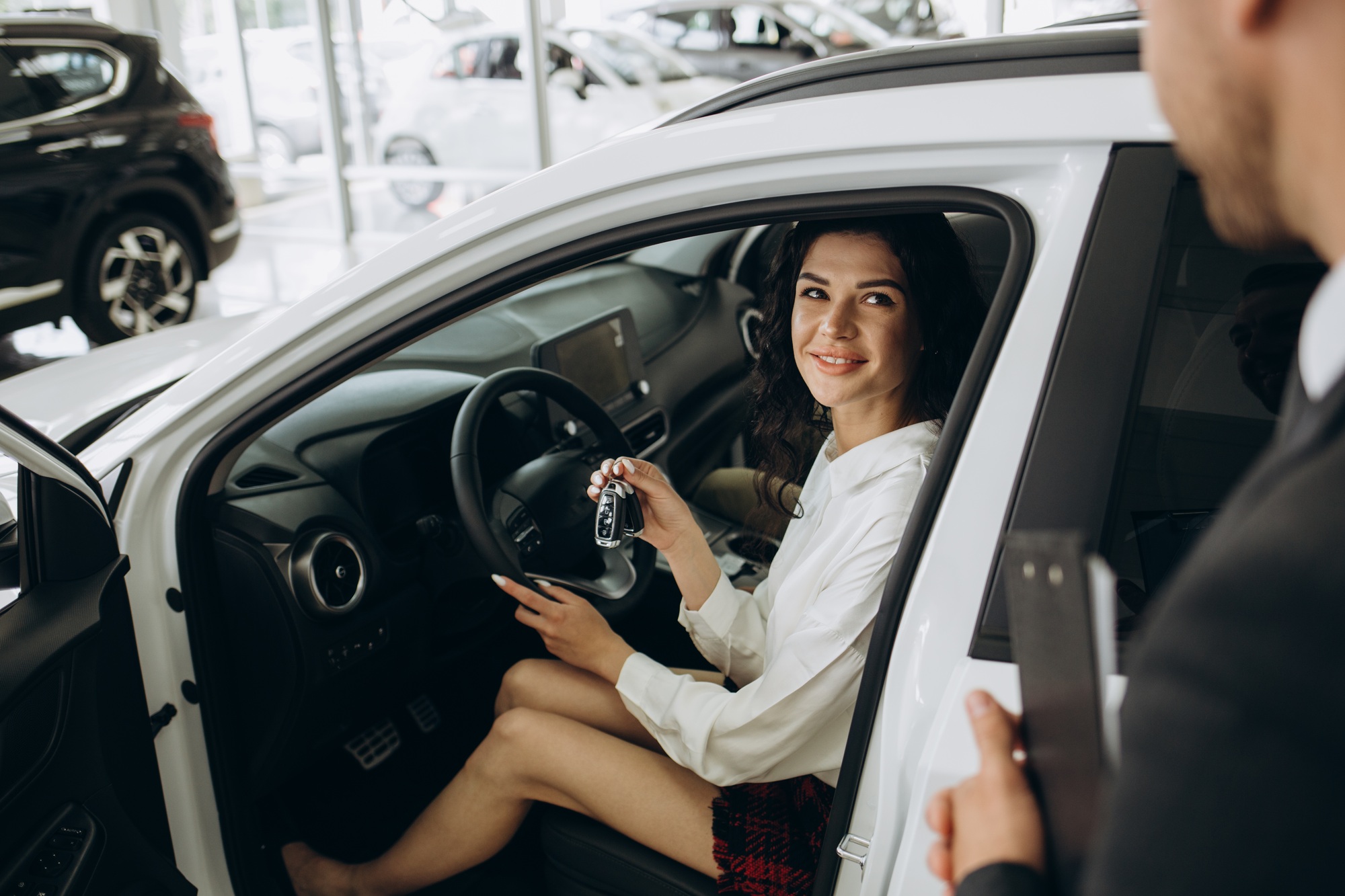 auto business, car sale, technology and people concept - happy couple with car dealer